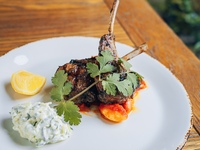 Black garlic marinated grilled lamb chops with fried okra bamies sauce and tzatziki